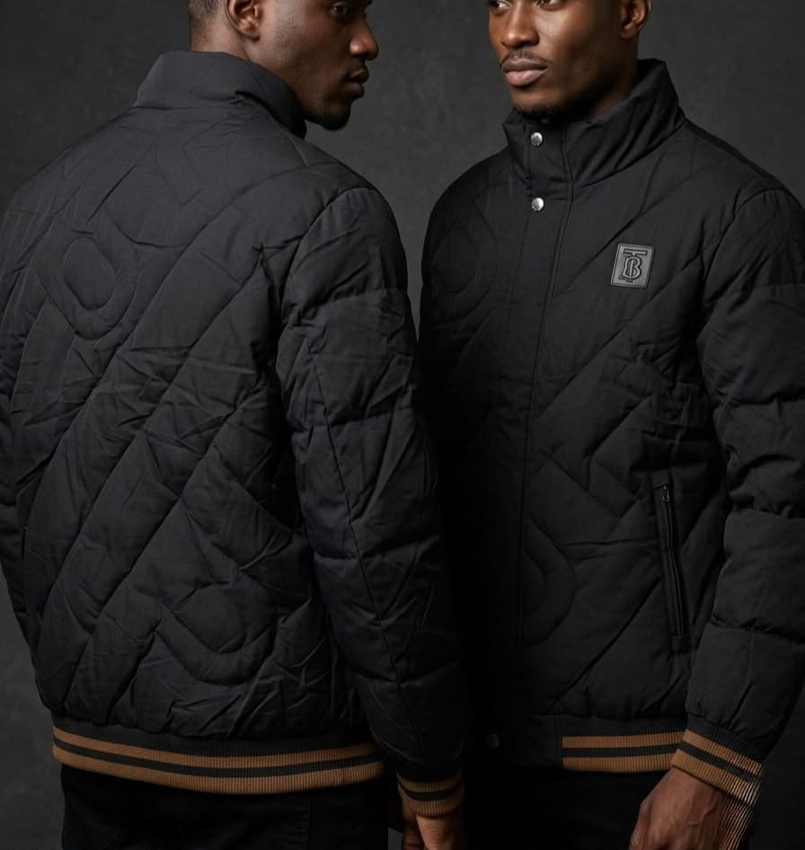 Men wearing a geometric quilted winter bomber jacket with high collar and ribbed trims
