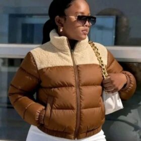 Women's sherpa collar puffer jacket featuring a padded quilted design, raised collar, full zip closure, long sleeves, and side pockets.
