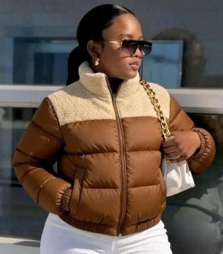 Women's sherpa collar puffer jacket featuring a padded quilted design, raised collar, full zip closure, long sleeves, and side pockets.