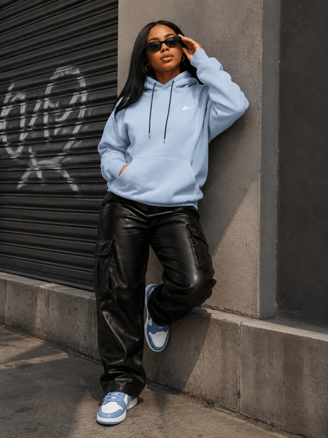 Woman wearing women’s premium essential pullover hoodie